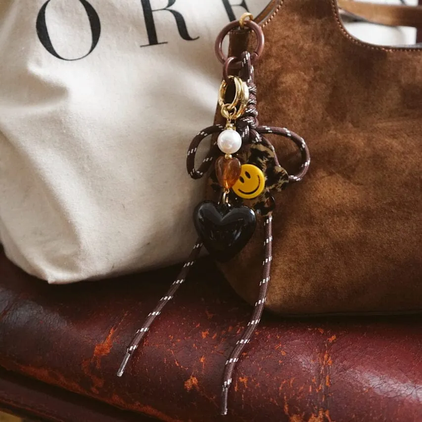 Orelia Brown Cord Bow taskecharm brun sløjfe