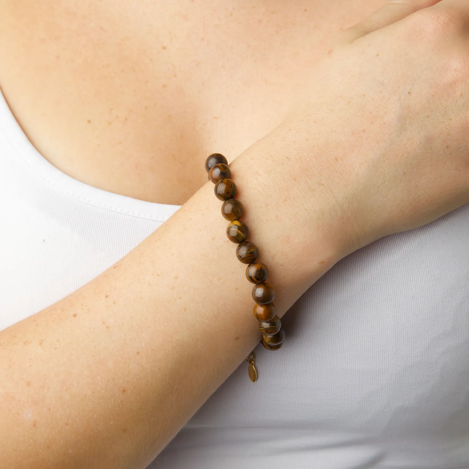 TIMI OF SWEDEN Birgit tigerøje armbånd guld rustfrit stål