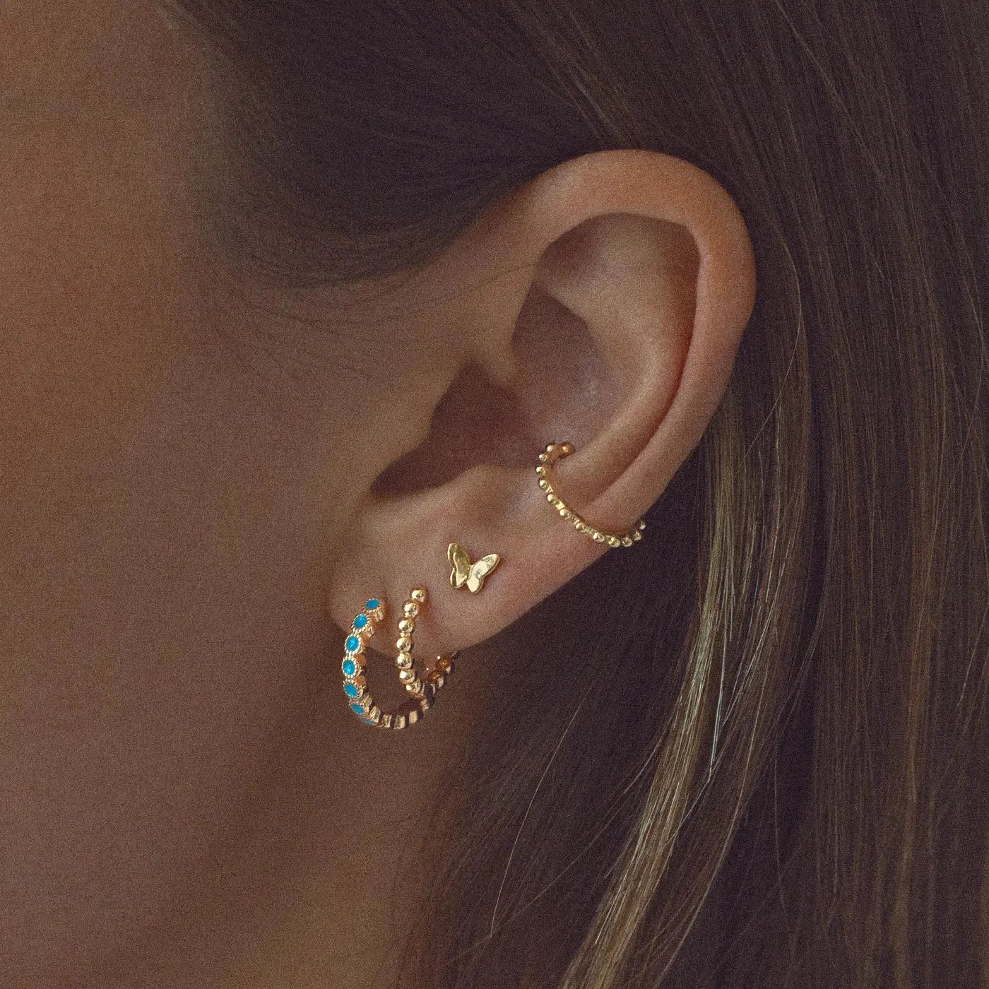 TIMI OF SWEDEN Liza Mini Butterfly ørestikker guld 6mm