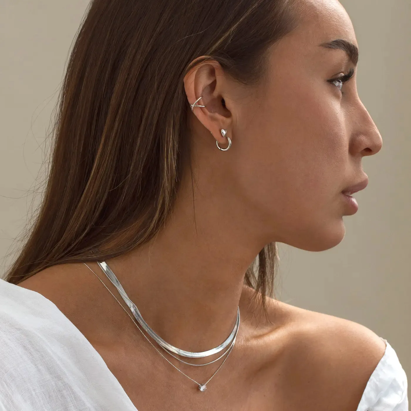 TIMI OF SWEDEN Uli Crossed earcuff 10 mm guld sølv